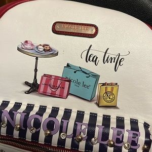 Nicole Lee rechargeable backpack with lots of small items that area